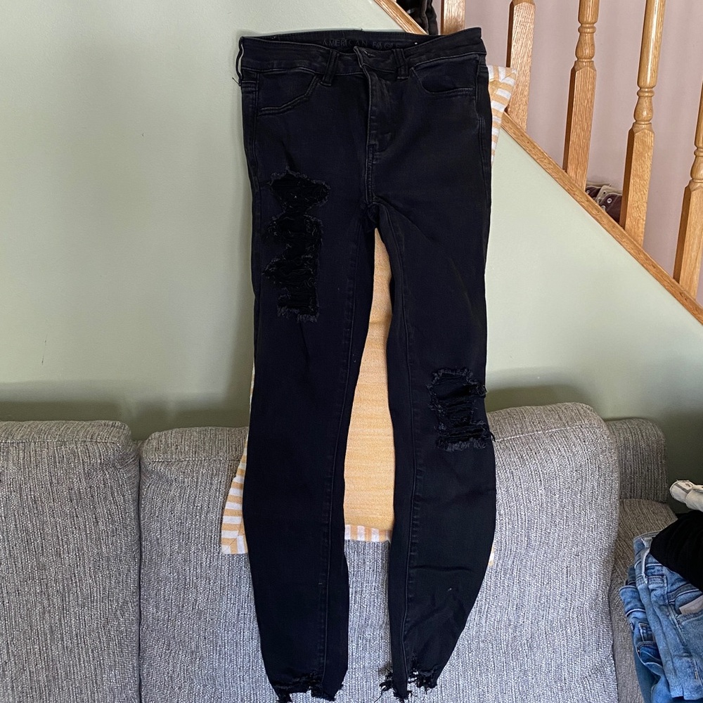 American Eagle Stretch Black Wash Denim Distressed Skinny Jeans. Unfinished hems